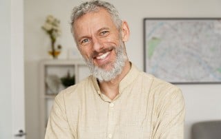 mature man smiling at home