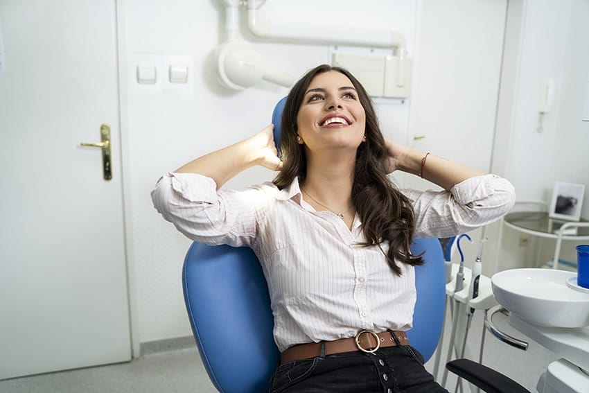 Attractive woman relaxes at the dentist thanks to sedation dentistry